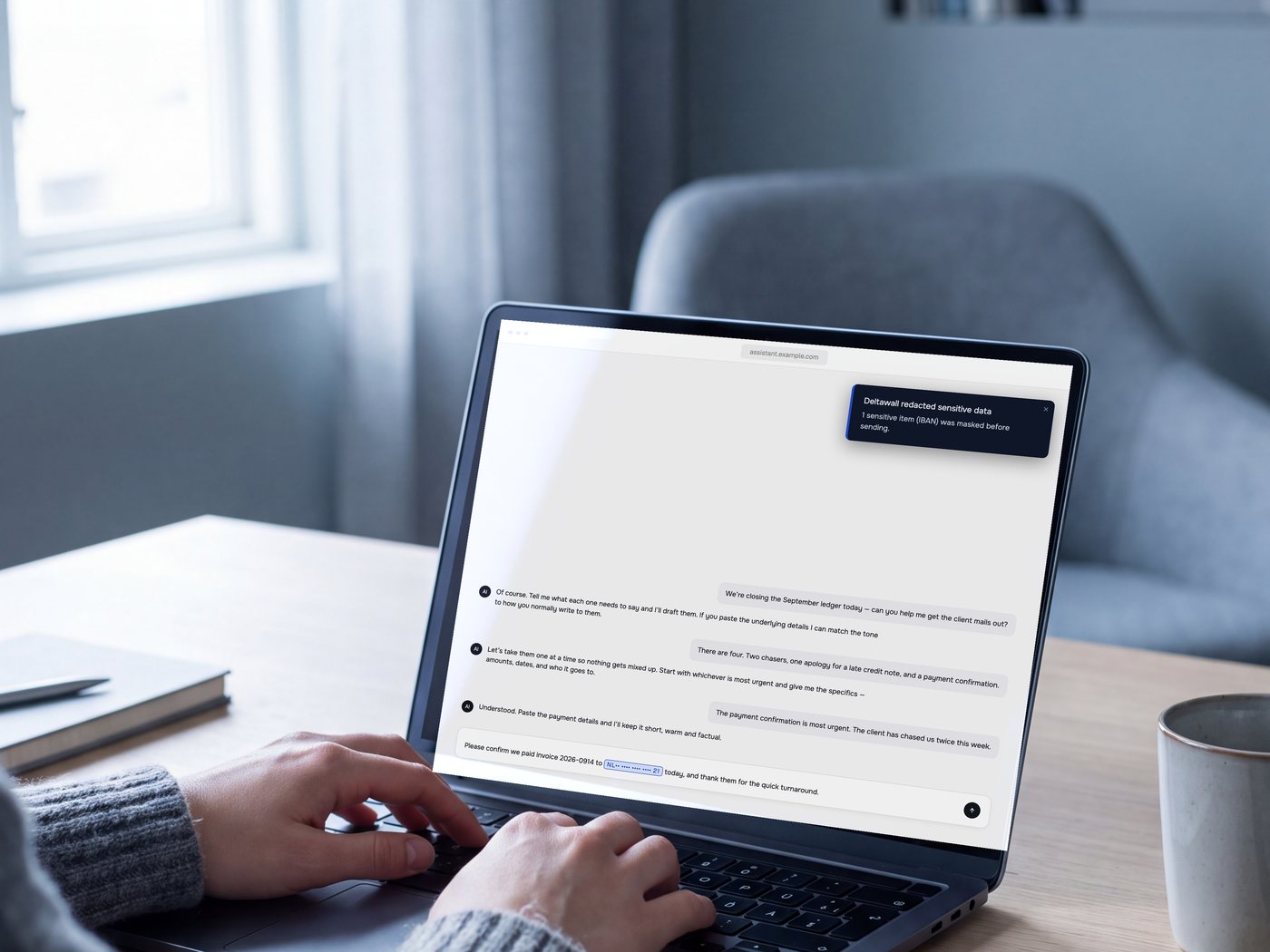 Hands typing at a laptop in a Dutch office. On the screen, the Deltawall banner confirms one IBAN was masked before sending.